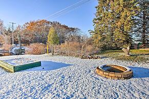Cozy Riverfront Home w/ Fire Pit in Houghton Lake!