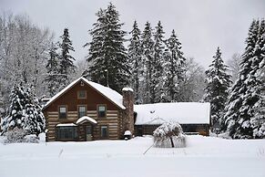 Log Cabin on the Wolf River w/ Private Hot Tub!