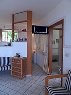 Apartment Immersed in a Large Garden Park Residence Cicladi