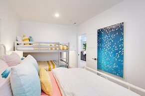 Pool Access & Lake Views: Modern Garden City Home