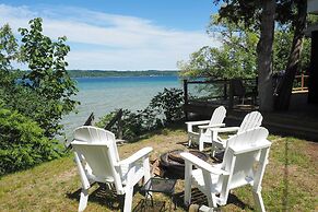 Waterfront Suttons Bay Cottage w/ Fire Pit!