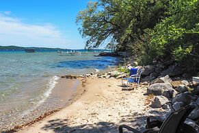 Waterfront Suttons Bay Cottage w/ Fire Pit!