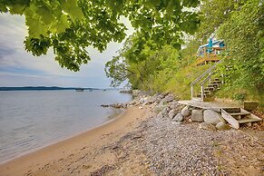 Waterfront Suttons Bay Cottage w/ Fire Pit!