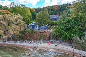 Waterfront Suttons Bay Cottage w/ Fire Pit!