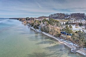 Waterfront Suttons Bay Cottage w/ Fire Pit!