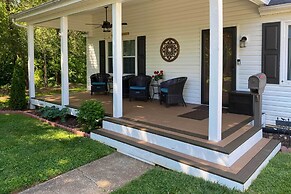 Quaint Creekside Cottage w/ Porch & Backyard!