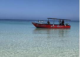 Seacret Studios - Cozy Jamaican Retreat Apts by RedAwning