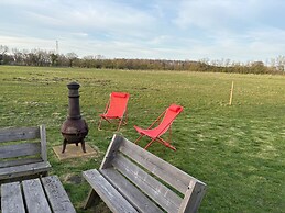 1br-sleeps2-field View-parking-cabin Experience