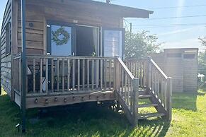 1br-sleeps2-field View-parking-cabin Experience