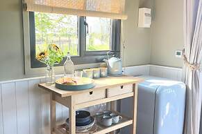 1br-sleeps2-field View-parking-cabin Experience