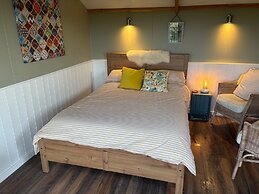 1br-sleeps2-field View-parking-cabin Experience