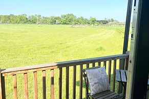 1br-sleeps2-field View-parking-cabin Experience