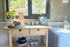 1br-sleeps2-field View-parking-cabin Experience