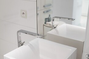 Minimalist Apartment Poznan by Renteres