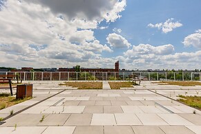 Studio Near Manufaktura Łódź by Renters