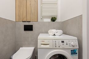 Studio Near Manufaktura Łódź by Renters