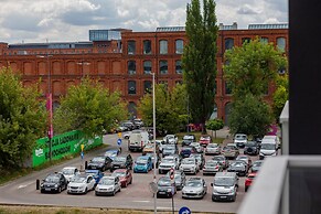 Studio Near Manufaktura Łódź by Renters