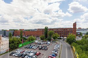 Studio Near Manufaktura Łódź by Renters