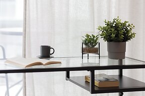 Studio Near Manufaktura Łódź by Renters