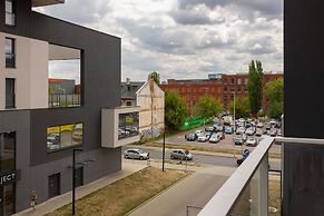 Studio Near Manufaktura Łódź by Renters