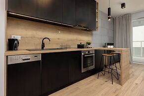 Studio Near Manufaktura Łódź by Renters