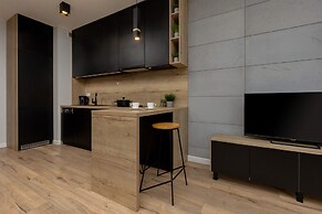 Studio Near Manufaktura Łódź by Renters