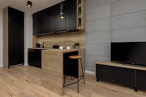 Studio Near Manufaktura Łódź by Renters