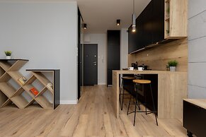 Studio Near Manufaktura Łódź by Renters