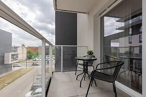 Studio Near Manufaktura Łódź by Renters