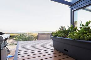 Coast Beachfront Retreat