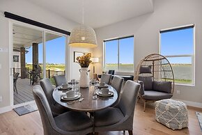 Upscale Waterfront Estate With Mountain Sunset Views