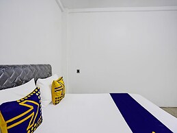 SPOT ON 92452 Griya Sandi Residence Family NearPantai Boom