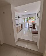 Four Bedroom apt w Patio Close to Beach and Center