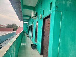 SPOT ON 92839 Nany Asoka Syariah Near Anyong Cafe Studio