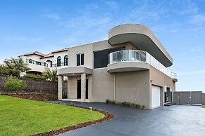 Cliffside Castle With Bay And City Views