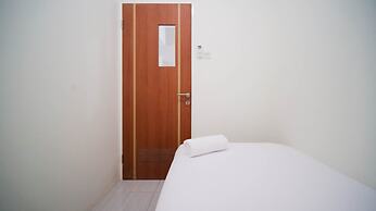 Cozy Living And Tidy 2Br At Puncak Dharmahusada Apartment