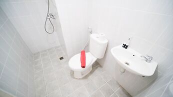 Cozy Living And Tidy 2Br At Puncak Dharmahusada Apartment