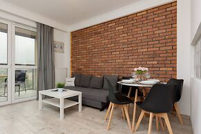 Rondo Wiatraczna Apartment by Renters